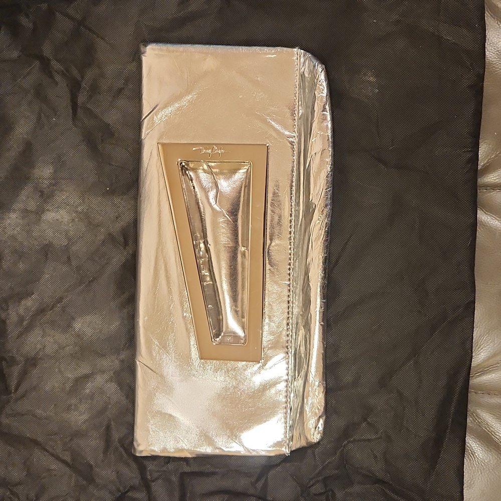 THIERRY MUGLER Silver clutch bag.  Clean satin interior.  Great condition